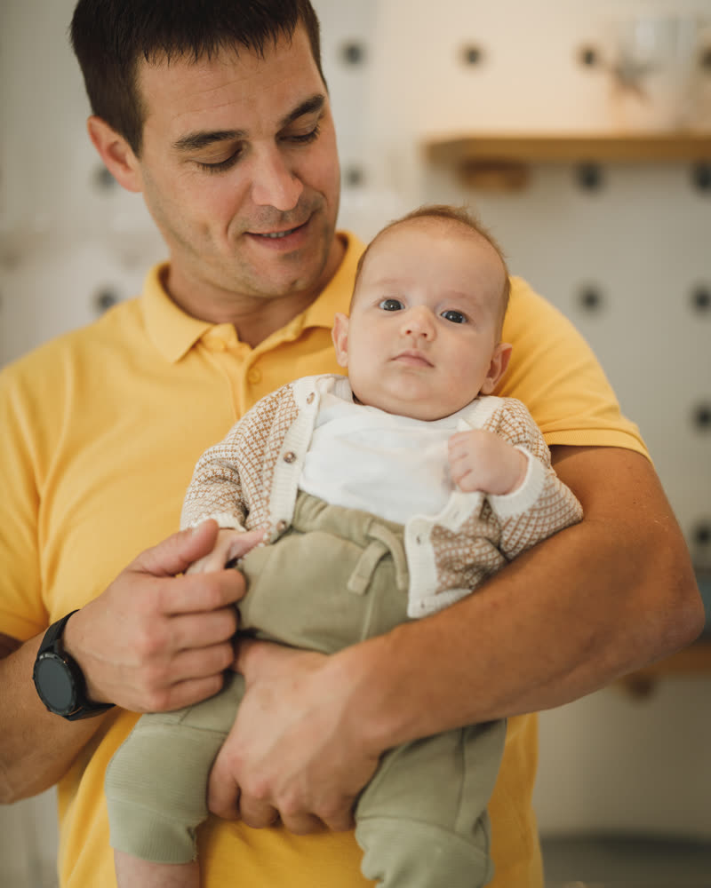 A man holding a baby
